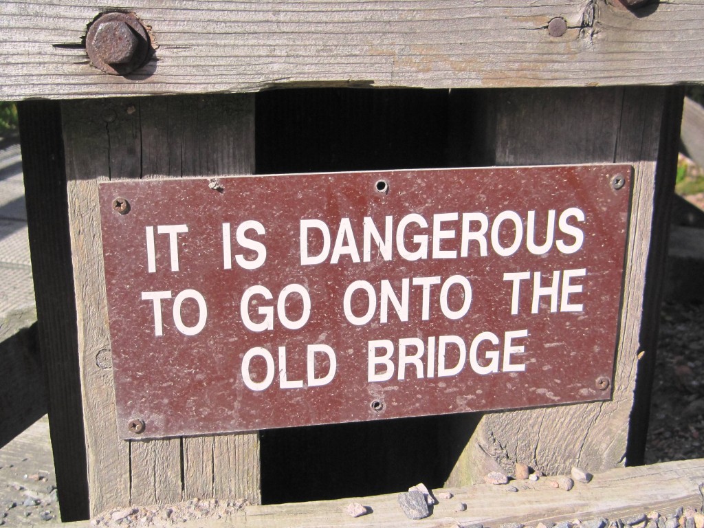Sign saying: It is dangerous to go onto the old bridge