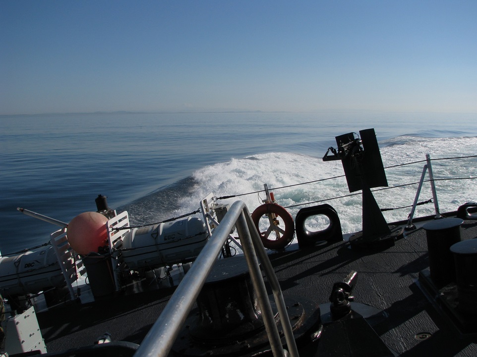 View of frigate's helicopter deck, canted to starboard.