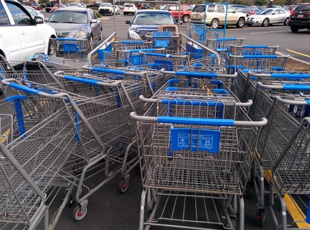 Jumble of shopping carts in a parking lot.