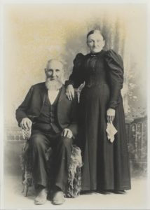 Black and white studio portrait of old couple in 1894.