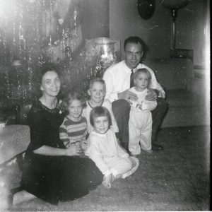 Black and white Christmas photo of Gibson family