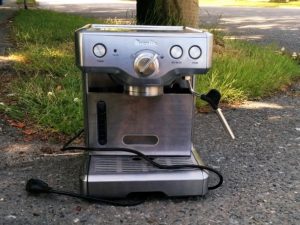 Stainless steel Breville coffee maker in a Vancouver alley.