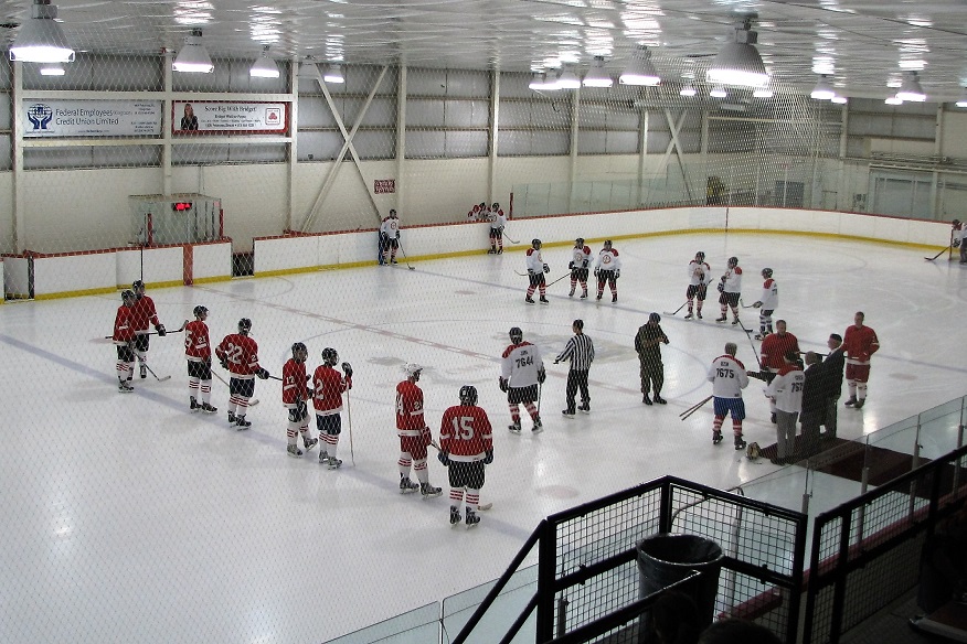 Two pick-up teams line up for the start of a hockey game