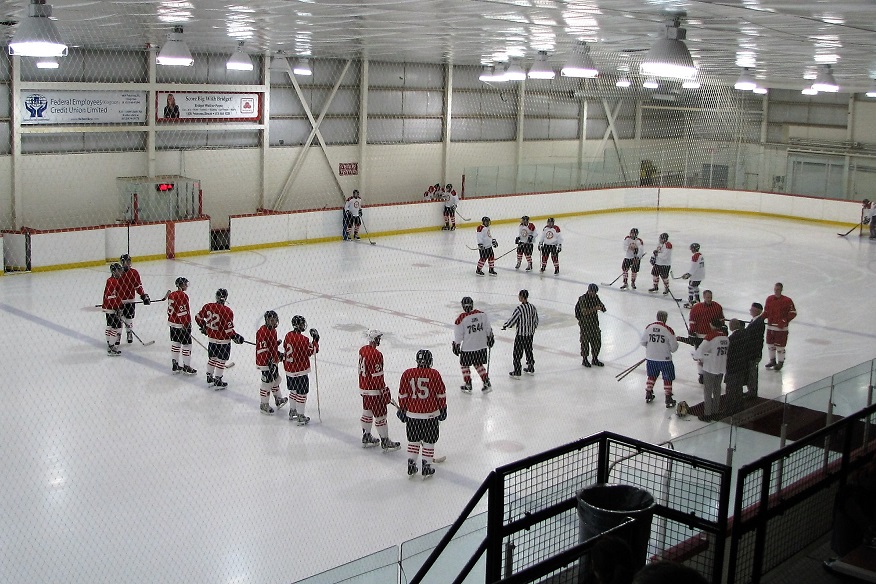 Two pick-up teams line up for the start of a hockey game