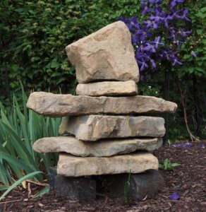 Inukshuk or inunnguaq in garden in Ottawa, ON