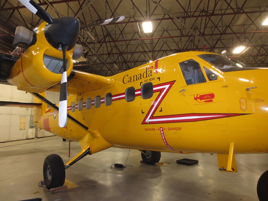Yellow Twin Otter in hangar in Yellowknife.