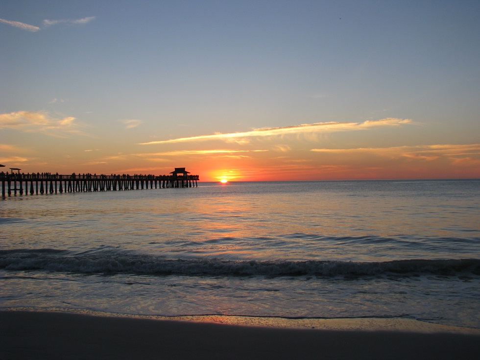 Dock outlined against setting sun