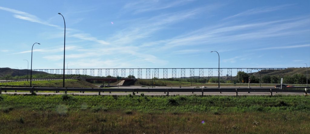 View of High Level Bridge in distance, with freeway in foreground.