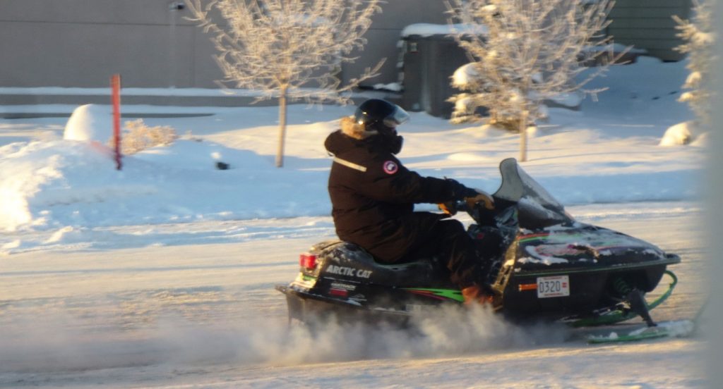 Snowmobiler on Yellowknife street.