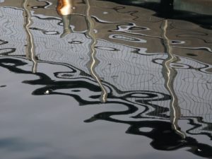 Reflection of metal railing and mesh fence