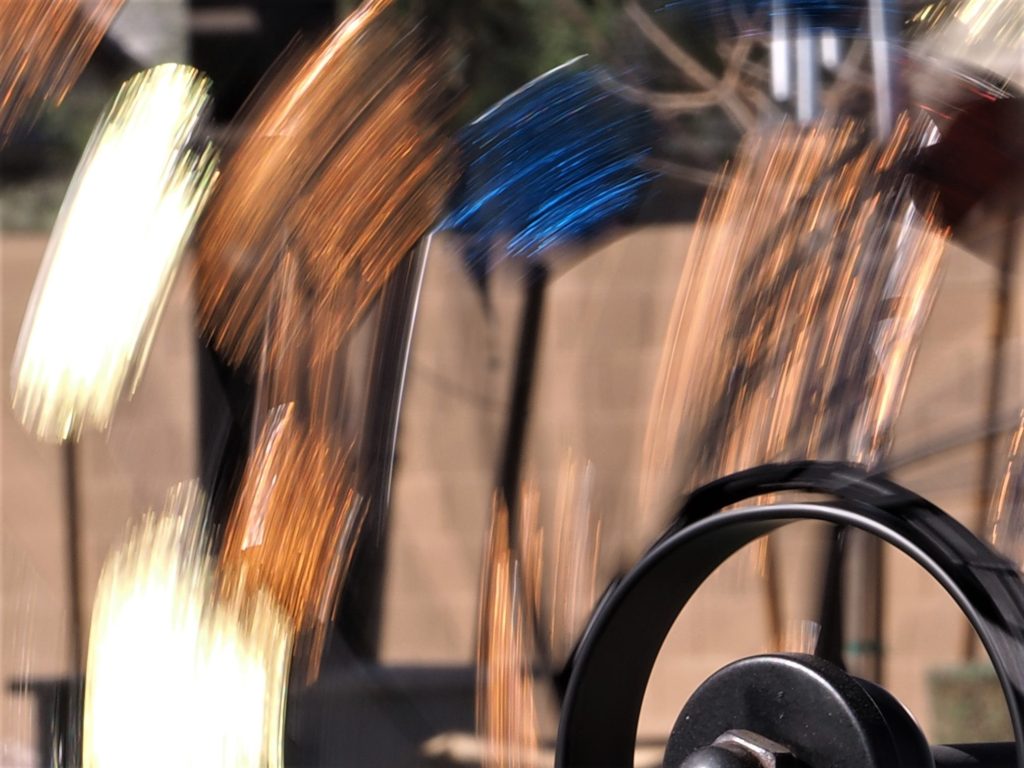 Coloured streaks from a wind spinner, using a slow shutter speed.