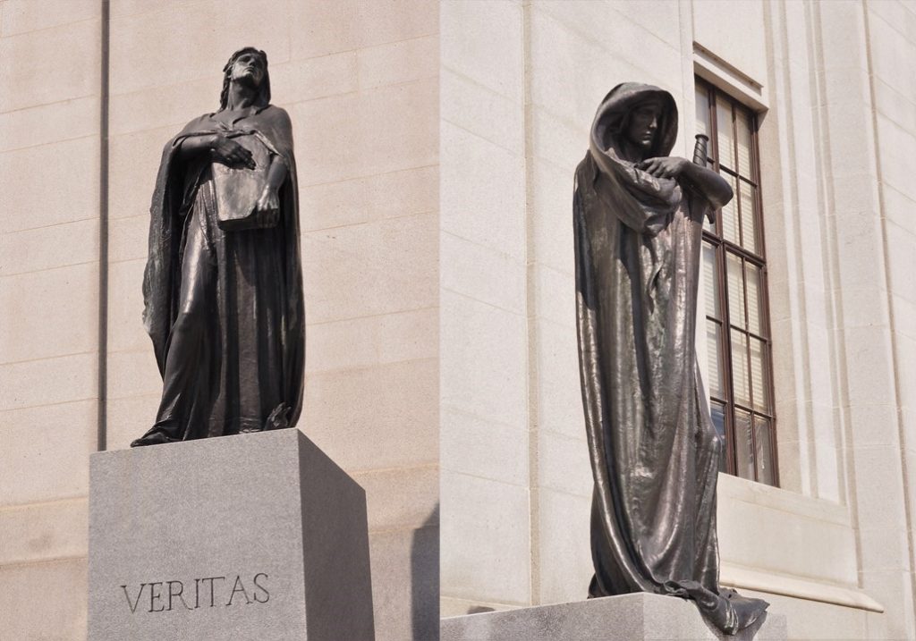 Full-figure shots of bronze statues in front of Supreme Court of Canada