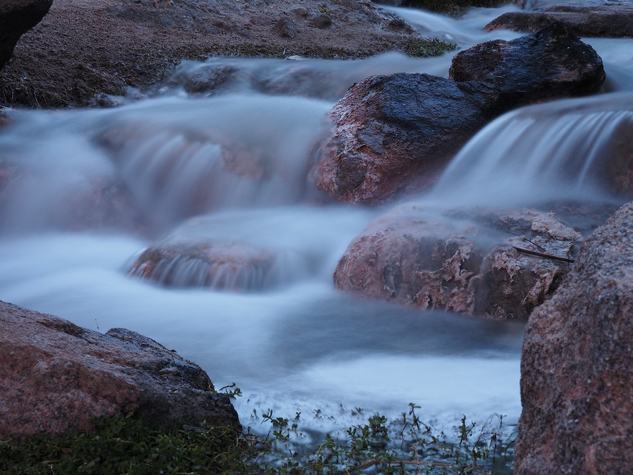 Long-exposure shot of rocky waterfall.