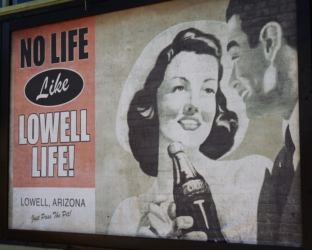 Old sign encouraging civis pride in Lowellites.
