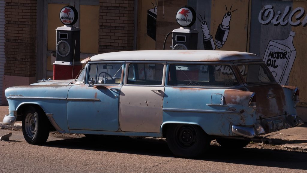 Blue and rust(ed) Chevy station wagon.