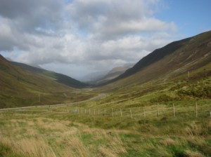 Pass through mountains en route to Skye; grassy foreground.