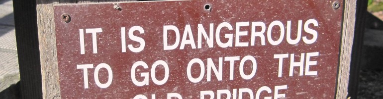 Sign saying: It is dangerous to go onto the old bridge