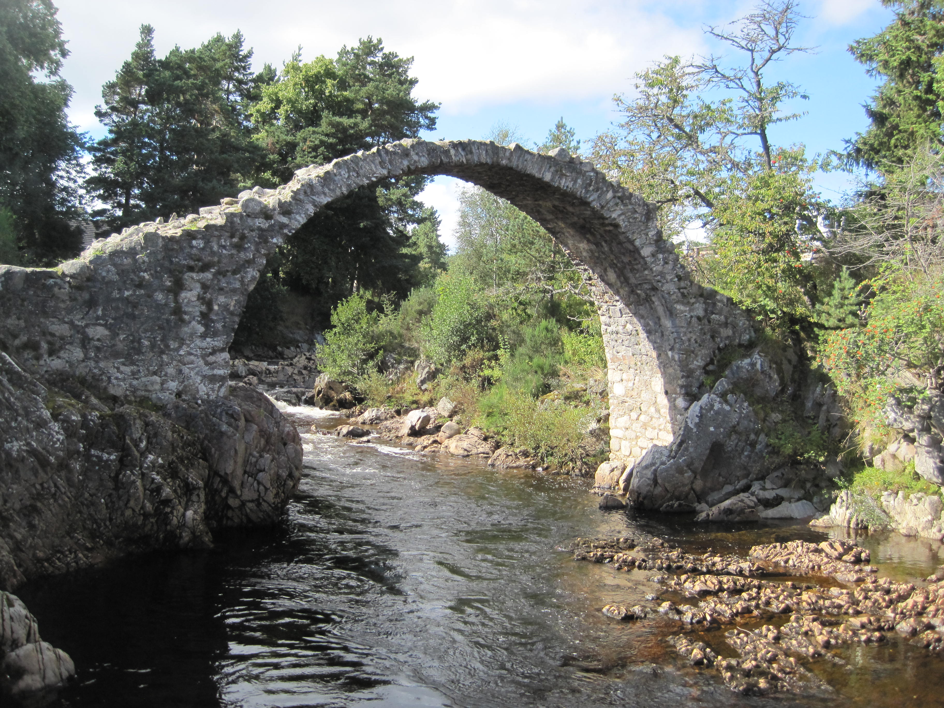 Arched stone bridge with 5-foot displacement in arch.