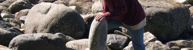 Kent Avery balancing rocks in Stanley Park