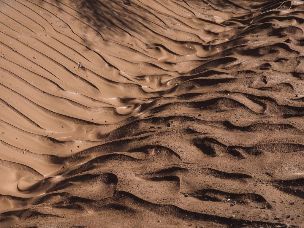Ripples of mud in a desert wash after a flood in Phoenix.