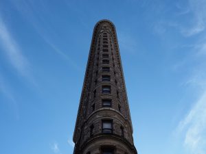 Straight-up overhead view of Flatiron Building, showing its shape but not its base.