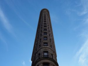 Straight-up overhead view of Flatiron Building, showing its shape but not its base.
