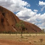 View of one end of Uluru (Ayer's Rock) with desert in foreground.