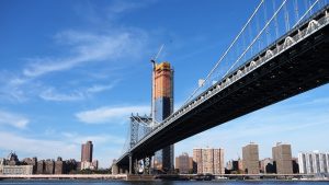 Shore-level view of Manhattan Bridge towers and span to Manhattan