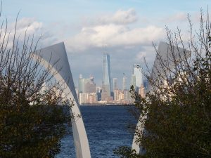 Staten Island 9/11 memorial in foreground; World Trade Center 1 in background.