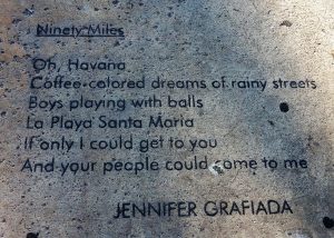 Poem craved in sidewalk near the 90-mile buoy.