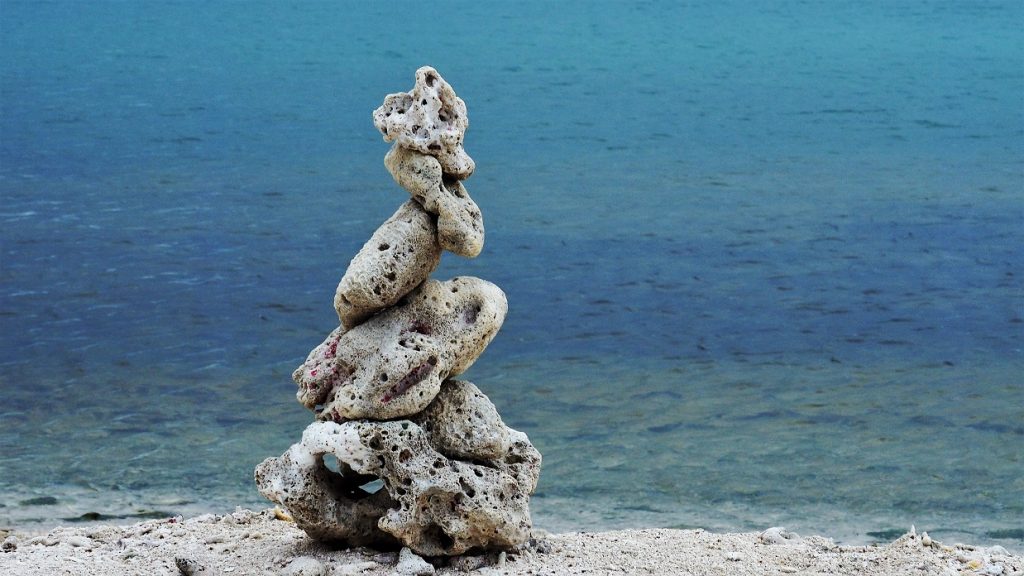 Weathered coral pieces stacked to make a tower.