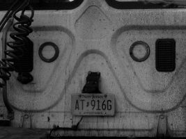 Accidental face on back of semi-truck cab.