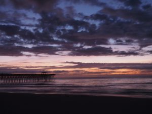 Fuzzy photo of Second Avenue Pier in Myrtle Beach at sunrise.