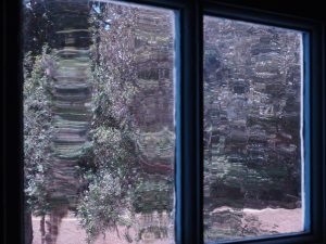 Wavy view through old window pane in Hampton Plantation, Georgetown SC.