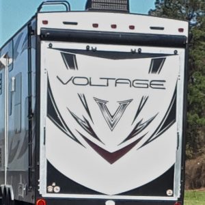 Rear view of RV or trailer with graphic face look-alike
