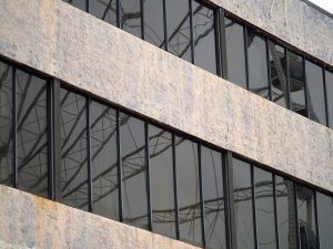 Skywheel reflected in building windows