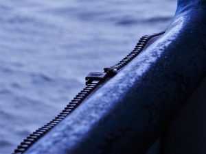 Zipper installed on side of passenger ferry to close awnings