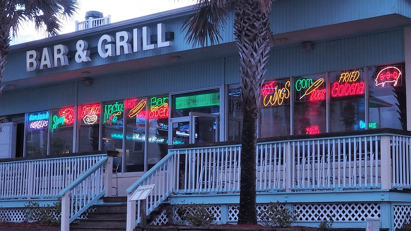 Panorama of neon signs advertising house specialties