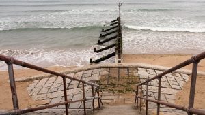 View of wooden breakwater from esplanade walkway