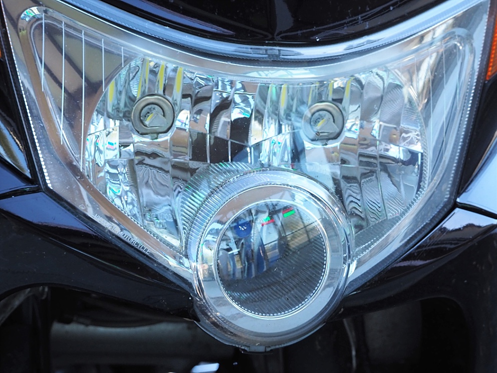 Serendipitous face on motorcycle headlight configuration
