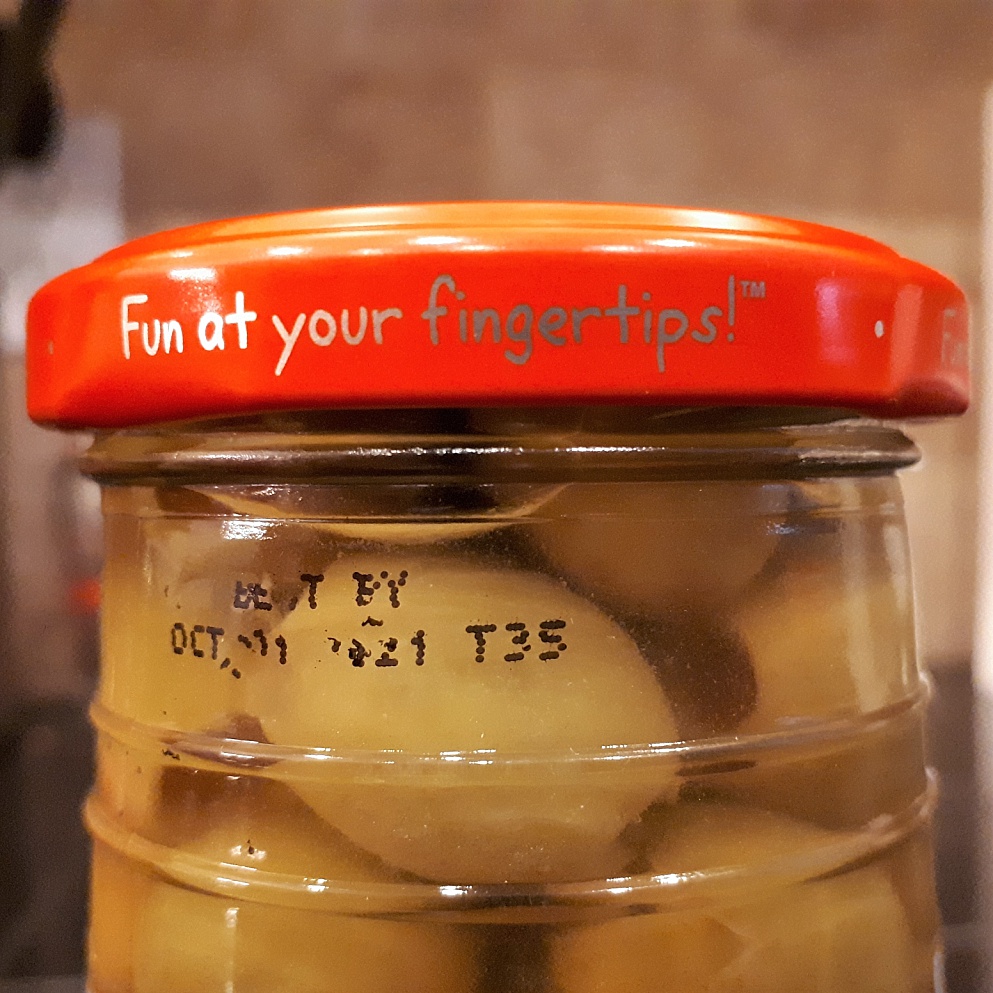 Fun is at your fingertips: lid from jar of olive