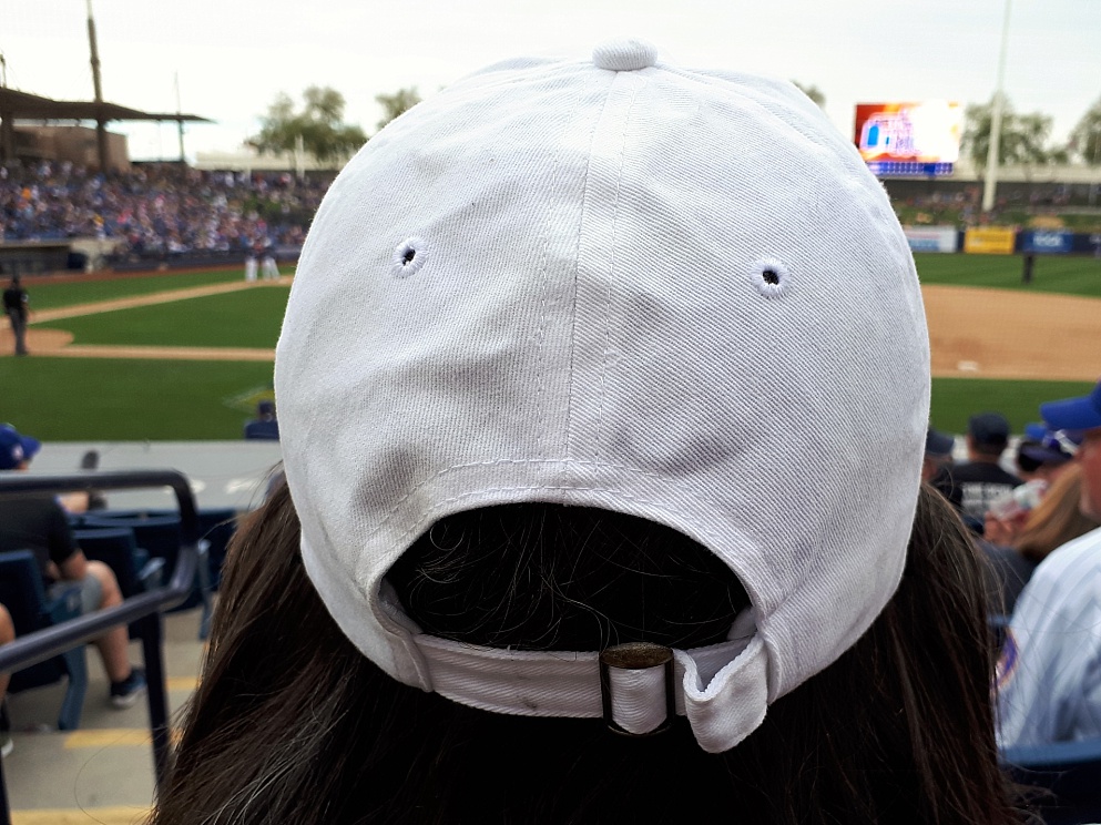 Accidental face on baseball cap.