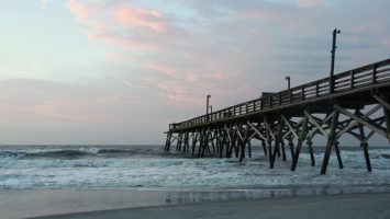 Wooden pier at Surfside Beach at dawn