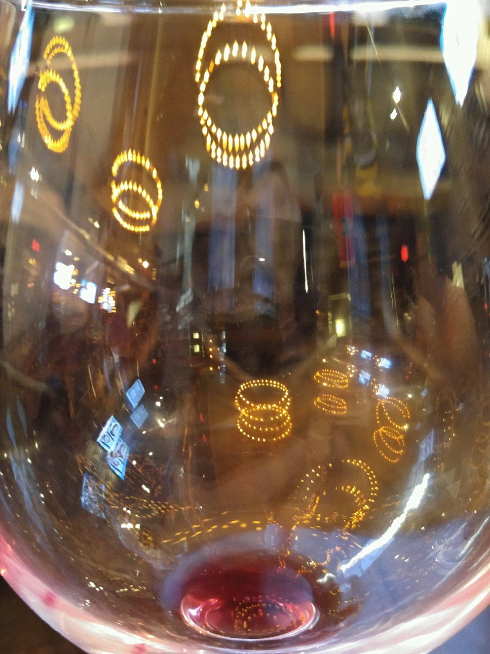 Reflections in an empty wineglass