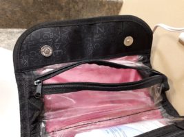 Gaping mouth of toiletry bag's face