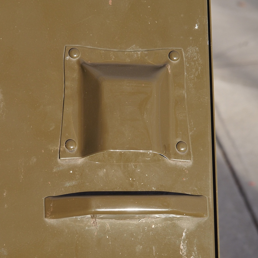 Inadvertent face on garbag-bin latch