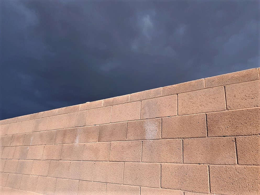 Brick wall and storm clouds