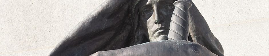 Close-up of Justice, in front of Supreme Court of Canada
