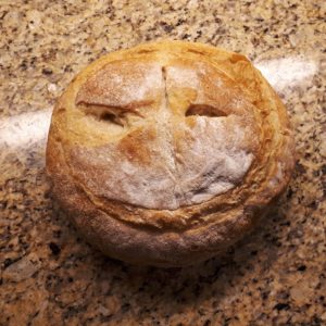 Found face on a loaf of bread.